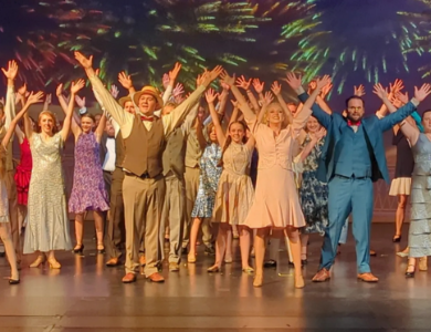 Performers on stage dancing